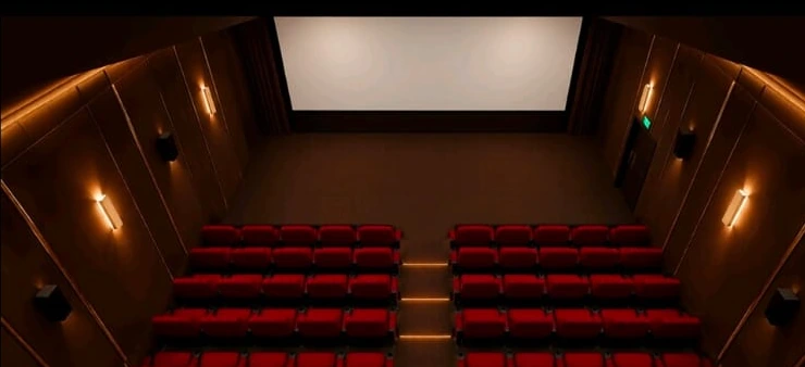 Visualisasi interior auditorium Metro Cinema dengan kursi merah dan panel dinding gelap